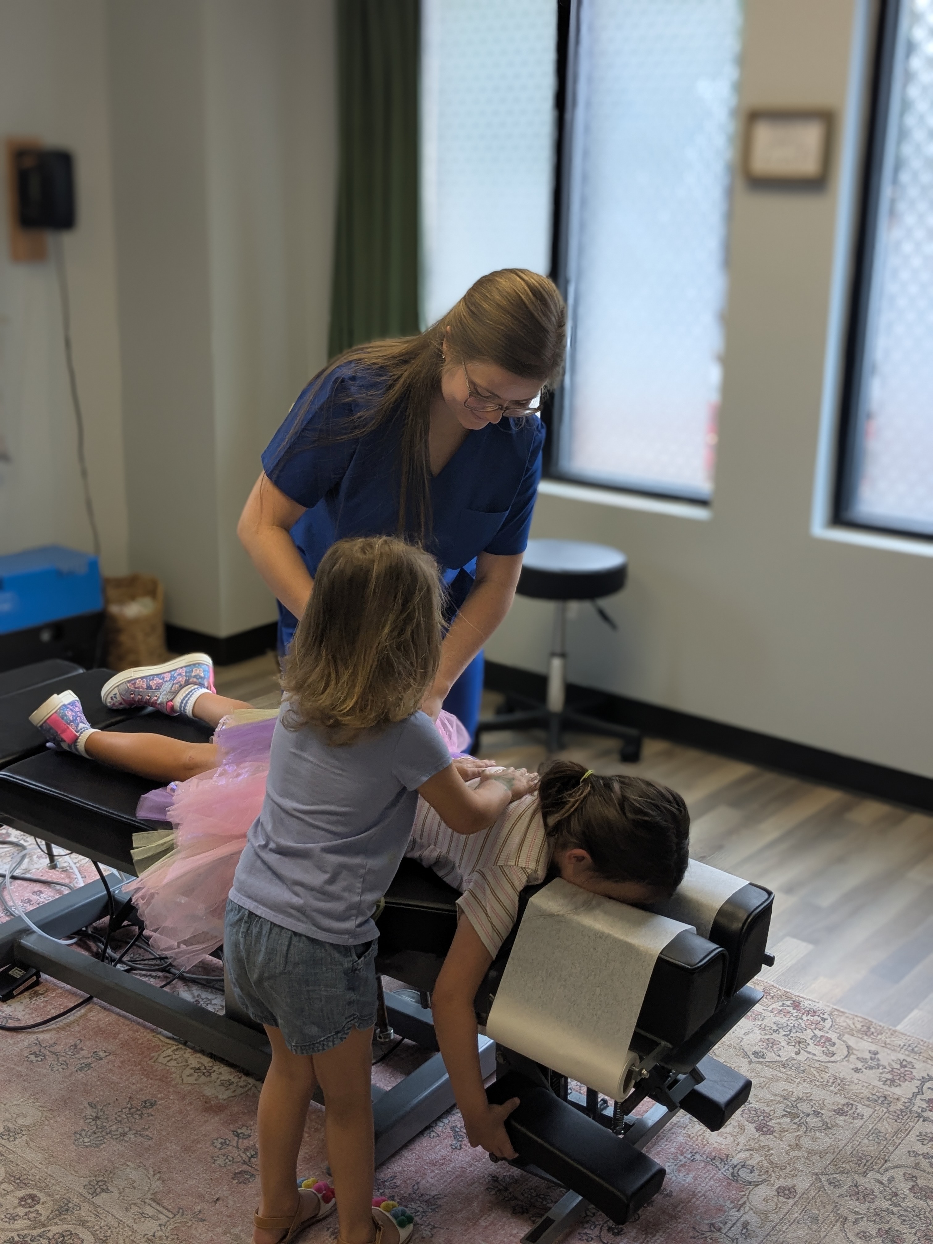 Chiropractor adjusting a child